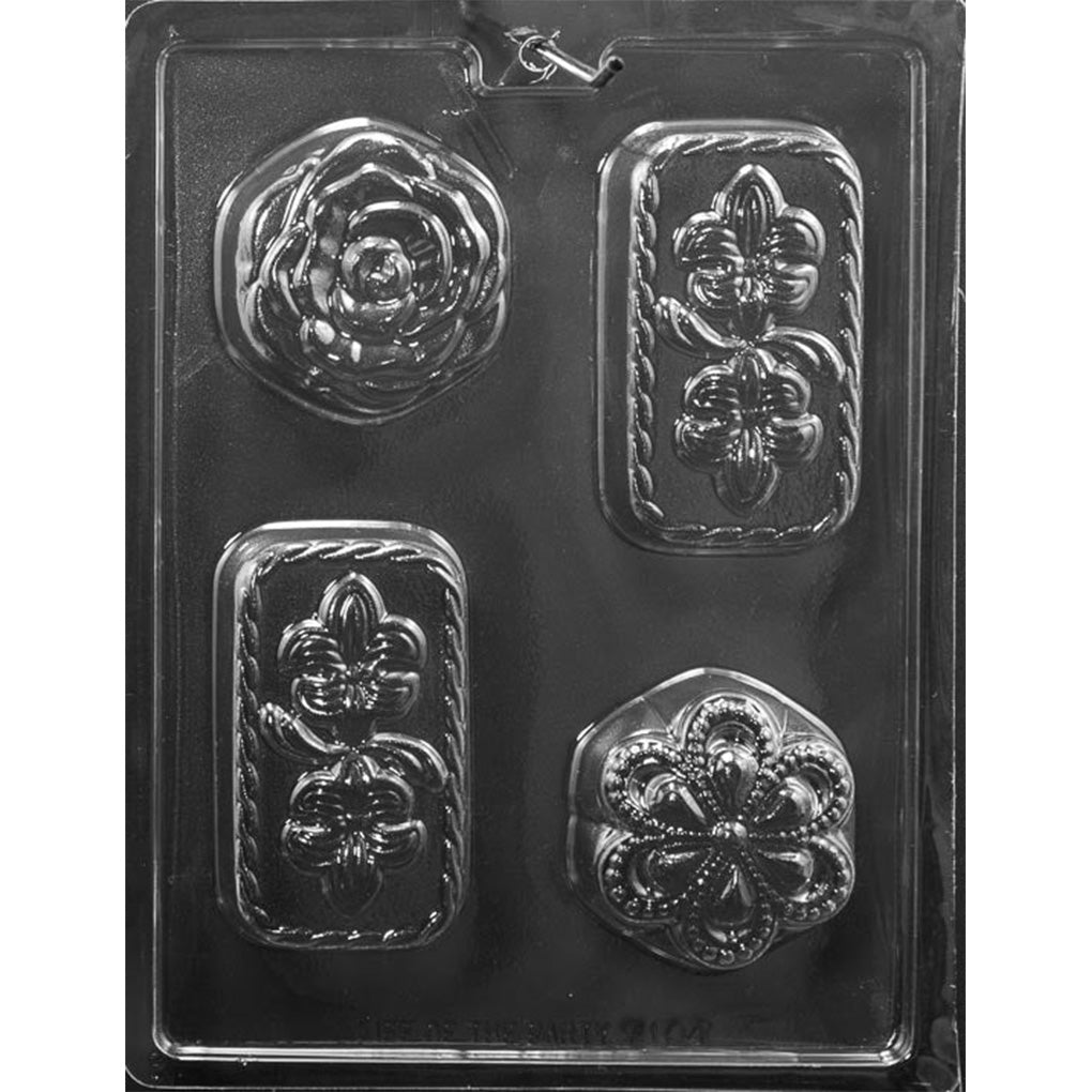 Clear plastic Flower Assortment Chocolate Mold with four deep cavities featuring a layered rose, ornate petaled blossom, and two rectangular fleur-de-lis bars