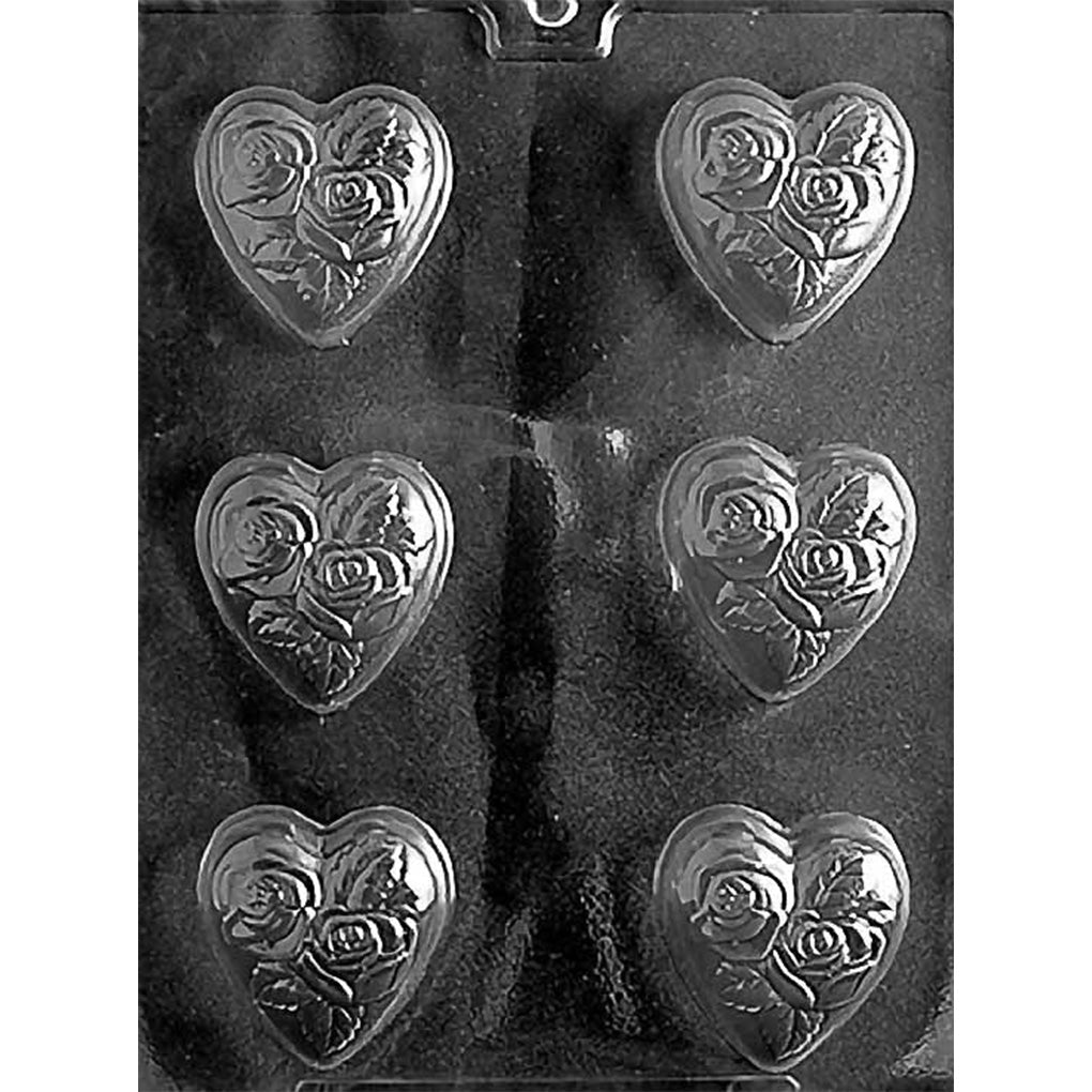 Chocolate mold with six deep heart-shaped cavities embossed with raised roses and leaves, designed for medium-sized romantic chocolates.