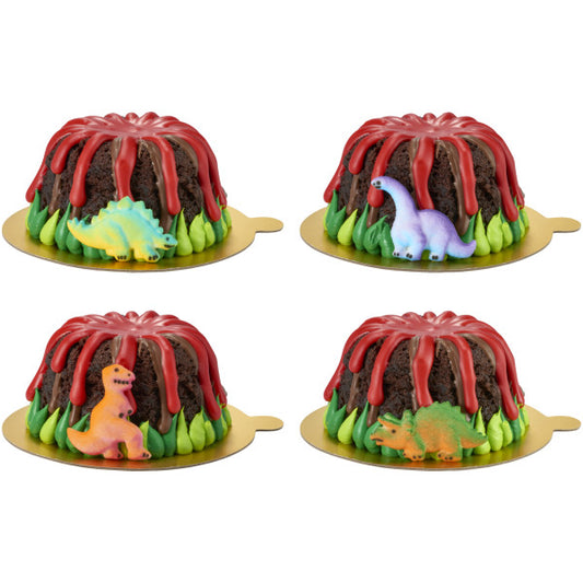 Four mini chocolate volcano bundt cakes decorated with red icing drip, green frosting base, and colorful dinosaur sugar toppers