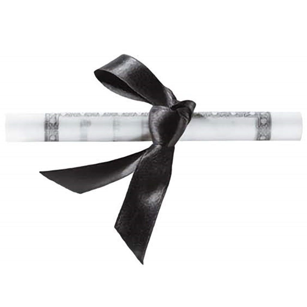 Rolled diploma cake topper tied with a black ribbon bow, showing a white certificate-style scroll with decorative printed borders on the ends.