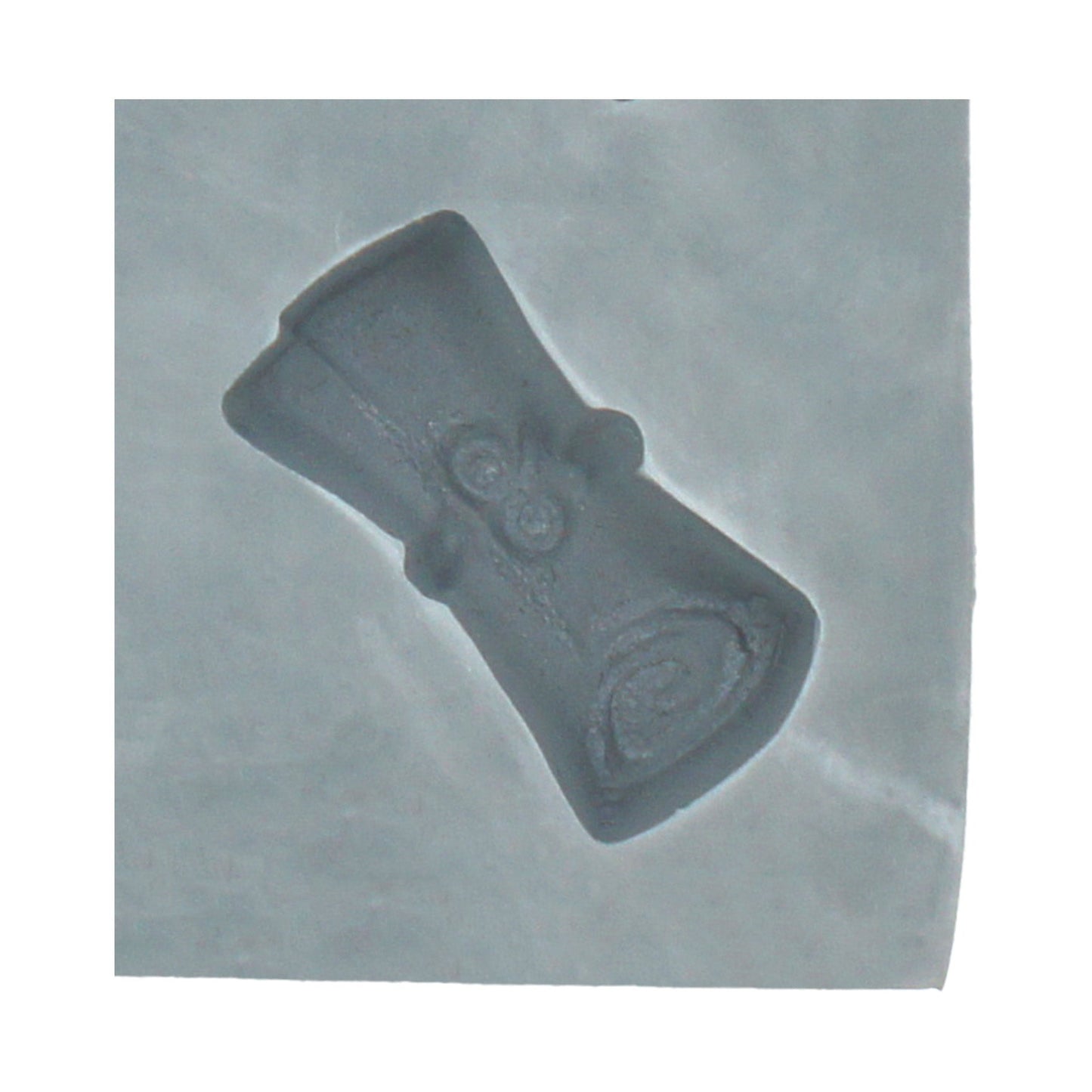 Close-up of a diploma-shaped cavity in a rubber mint mold, perfect for making cream cheese mints, chocolate, or fondant graduation treats.