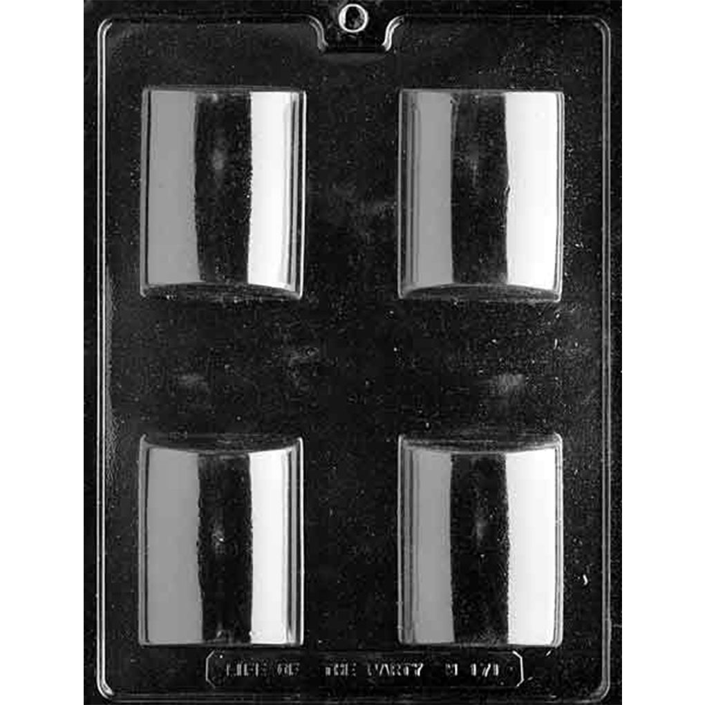 Clear plastic chocolate mold photographed on a dark background with four smooth domed bar cavities arranged in a two-by-two grid.