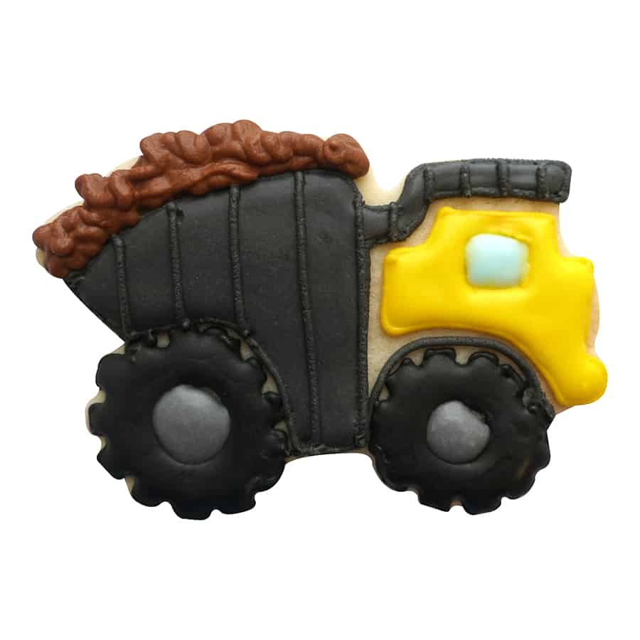A decorated dump truck cookie featuring black wheels, a yellow cab, and a brown load in the truck bed.