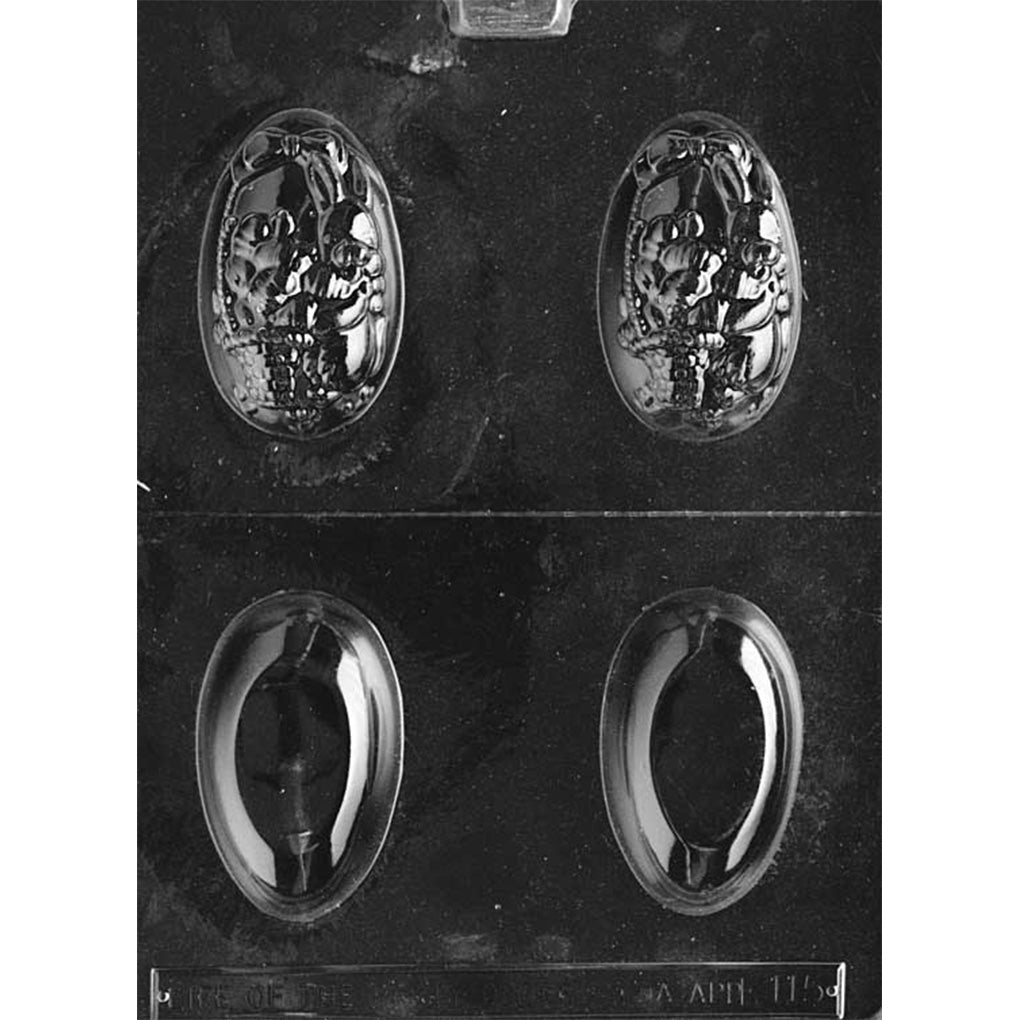 Clear plastic 3D Easter egg chocolate mold sheet with four egg cavities split by a center line, including two detailed eggs showing a bunny holding a basket and two smooth egg halves for forming a complete 3D egg.