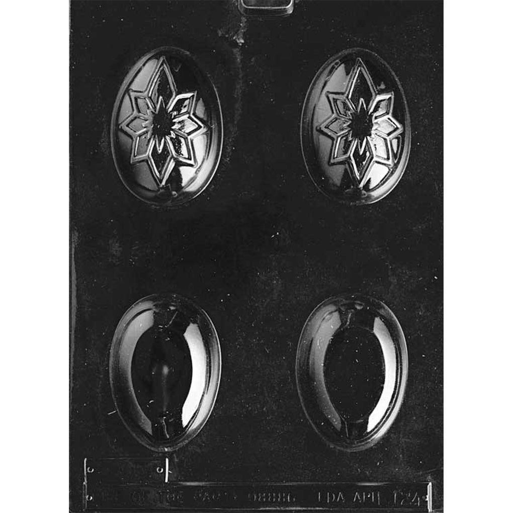 Egg with star chocolate mold showing four egg cavities, two with an embossed star design and two smooth egg halves.