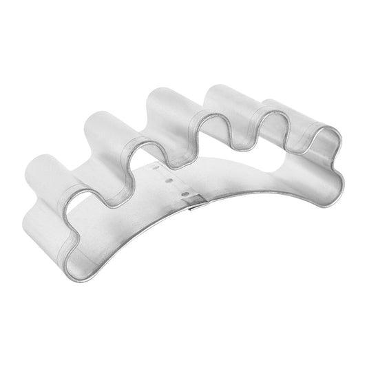 Angled side view of the eyelash cookie cutter, showing its curved design.