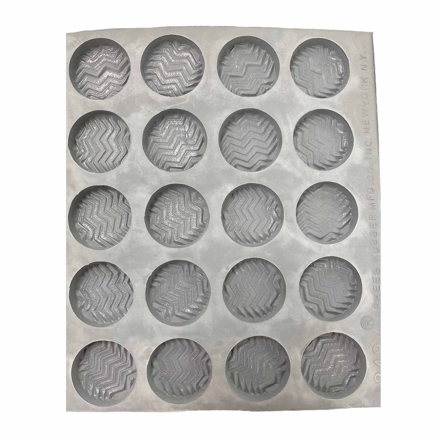 Full sheet of Fancy Mint #1 rubber mint molds with 20 round cavities, each embossed with a zigzag design.
