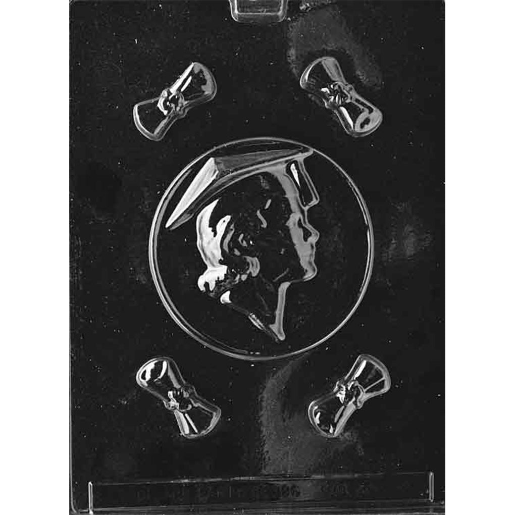 Clear plastic chocolate mold with one round female graduate profile cameo cavity and four small diploma scroll cavities around it, shown on a dark background.