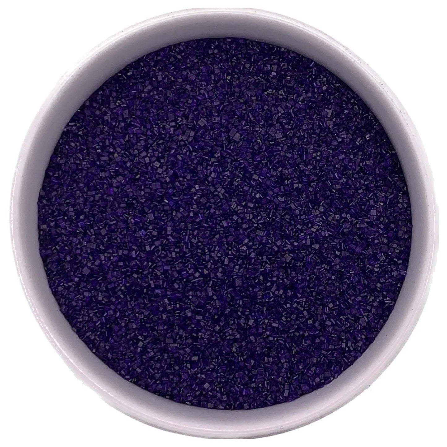 Top-down view of a white bowl filled with purple fine sanding sugar, showing tiny sparkling crystals in a deep violet-purple shade.