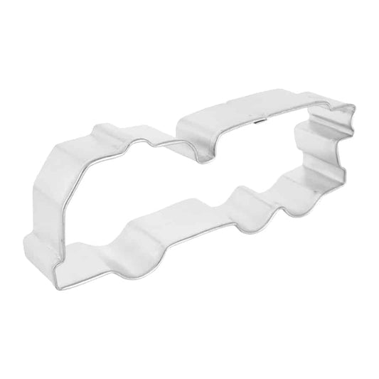Angled side view of the fire truck-shaped cookie cutter, showing its raised edges and sturdy construction for shaping dough.