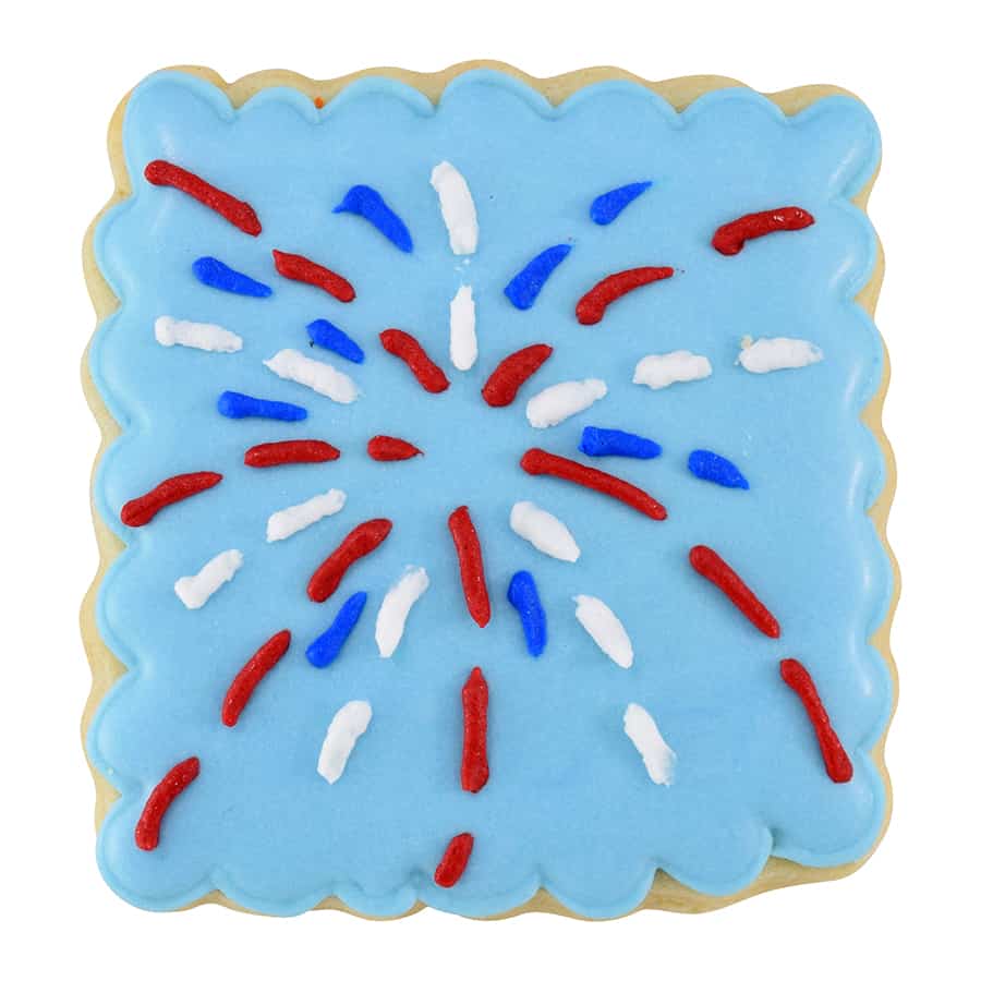 Decorated cookie made with Square Fluted Cookie Cutter, featuring blue icing with red and white sprinkles in a firework pattern.