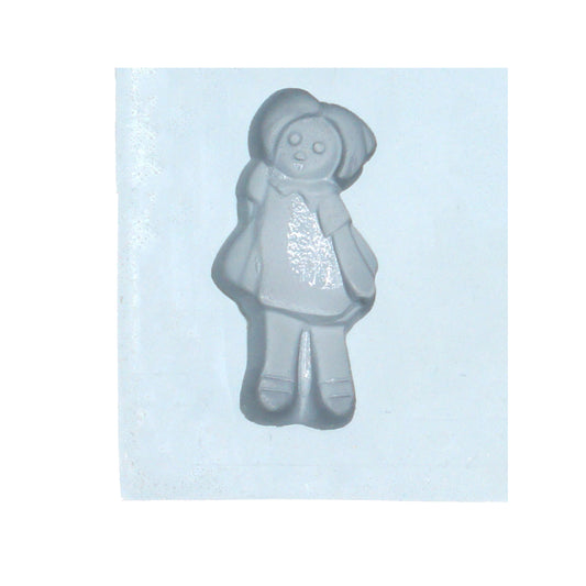 Close-up of Raggedy Ann doll-shaped rubber mint mold cavity made from natural rubber, showing detailed features like dress, shoes, and pigtails.