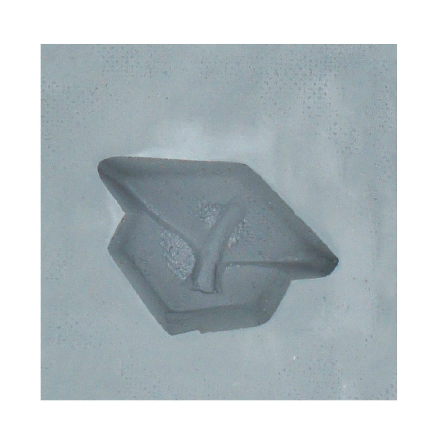 Close-up of a graduation cap-shaped mint mold cavity made from lead-free natural rubber, ideal for making cream cheese mints or candy decorations.