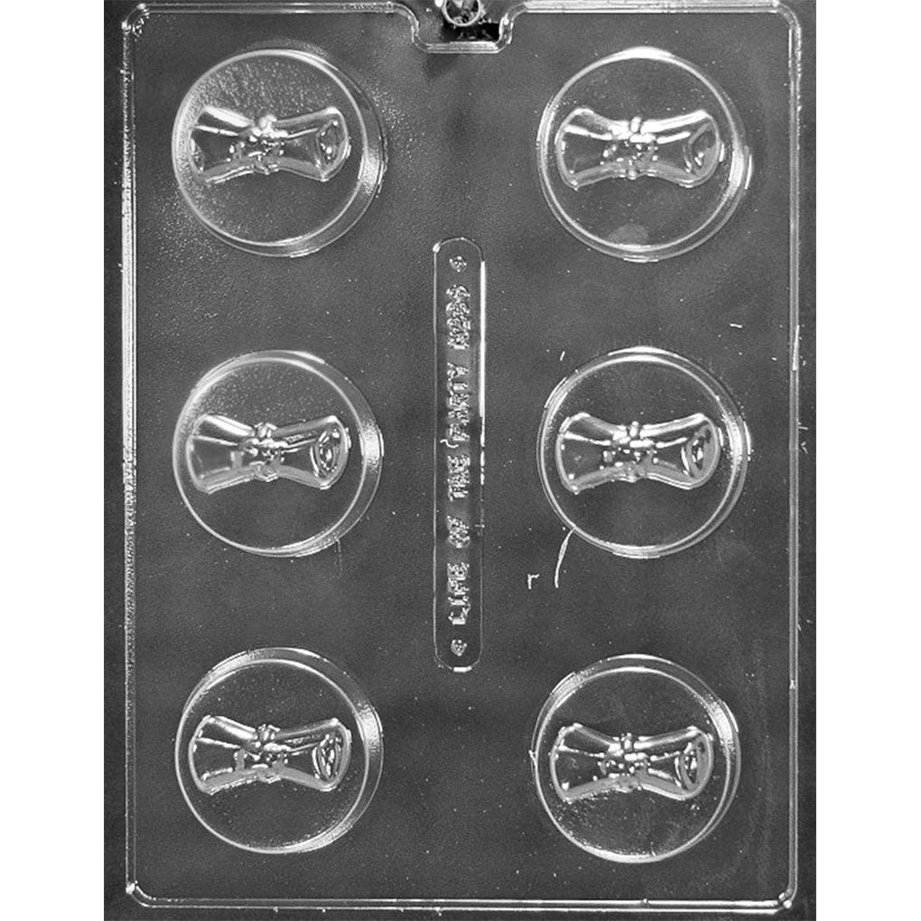 Clear plastic chocolate mold with six round cavities; each round cavity has a raised diploma scroll design in the center; displayed against a dark background for contrast.