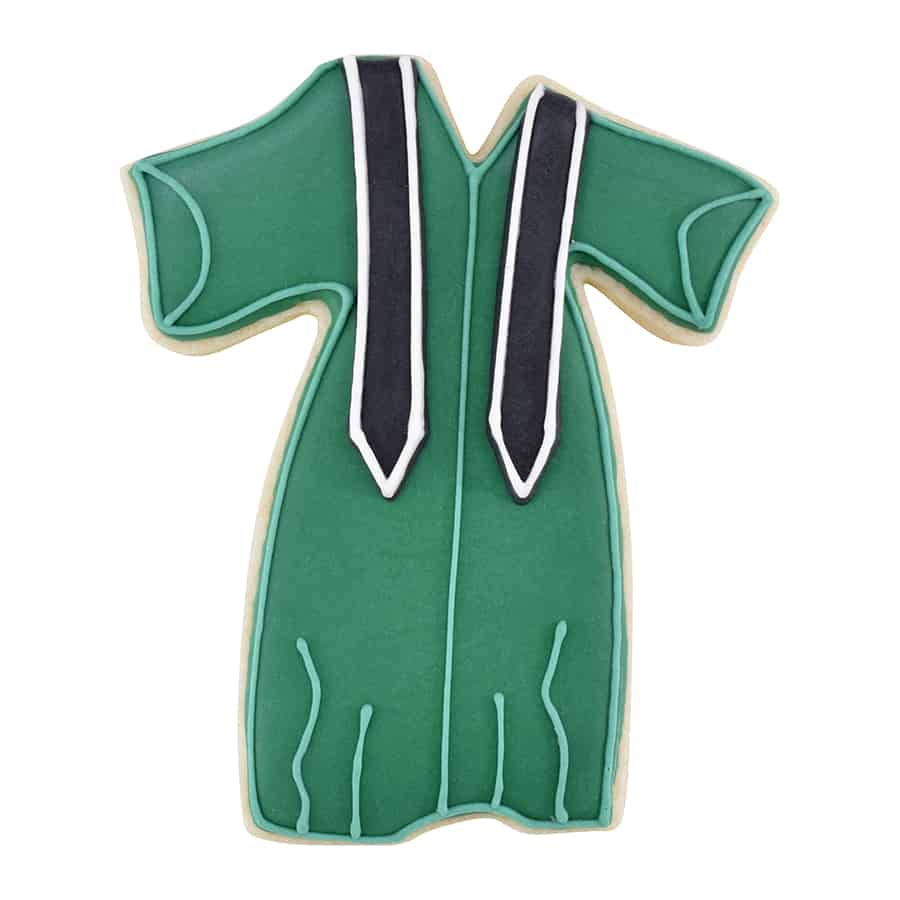 A decorated green cookie shaped like a graduation gown with black and white stole details.