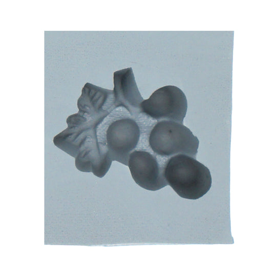 Close-up of grapes and leaf rubber mint mold with detailed grape cluster design