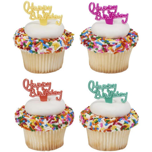 Yellow, pink, orange, and teal Happy Birthday cupcake picks displayed on four white-frosted cupcakes with rainbow sprinkles