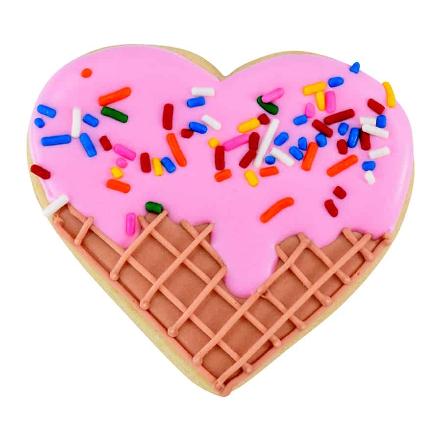 Ice cream cone-themed heart cookie with pink frosting, sprinkles, and cone design