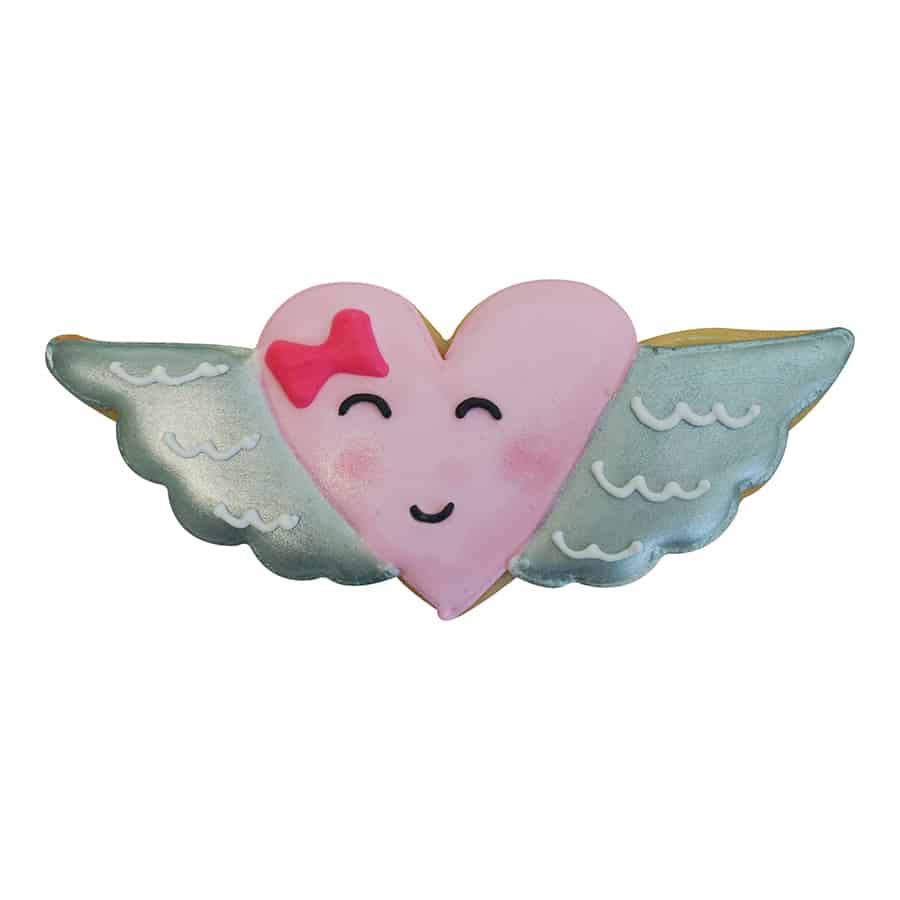 Decorated heart with wings cookie featuring a smiling pink heart with silver wings.