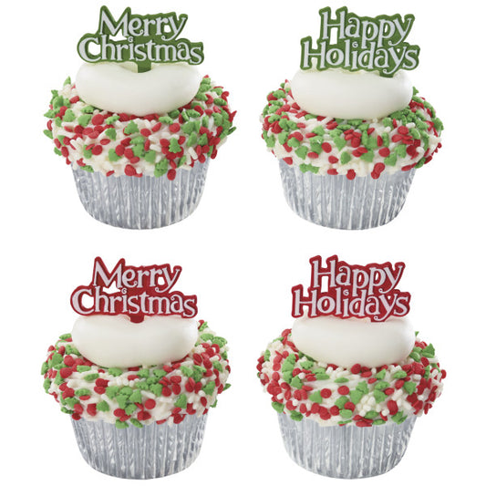 Four decorated cupcakes topped with holiday-themed picks and red, white, and green sprinkles.