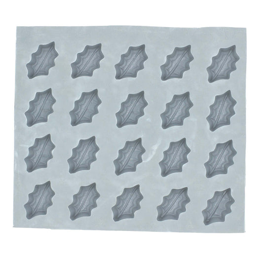 Full sheet of holly rubber mint molds with multiple festive leaf-shaped cavities for holiday candy making