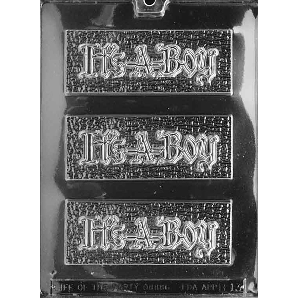 Clear plastic chocolate mold on a dark background with three long rectangular bar cavities, each featuring raised “It’s-A-Boy” script on a textured field.