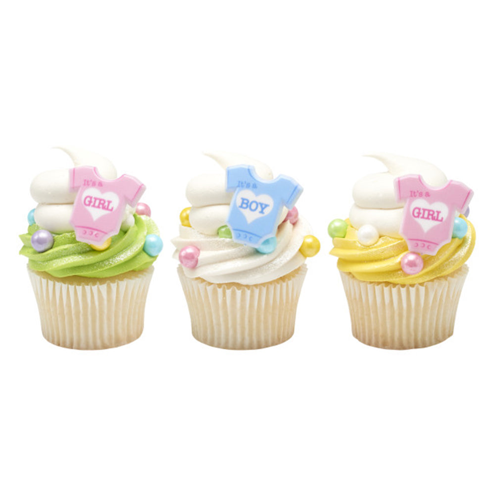 Three cupcakes decorated with blue "It's a Boy" and pink "It's a Girl" rings on colorful frosting.