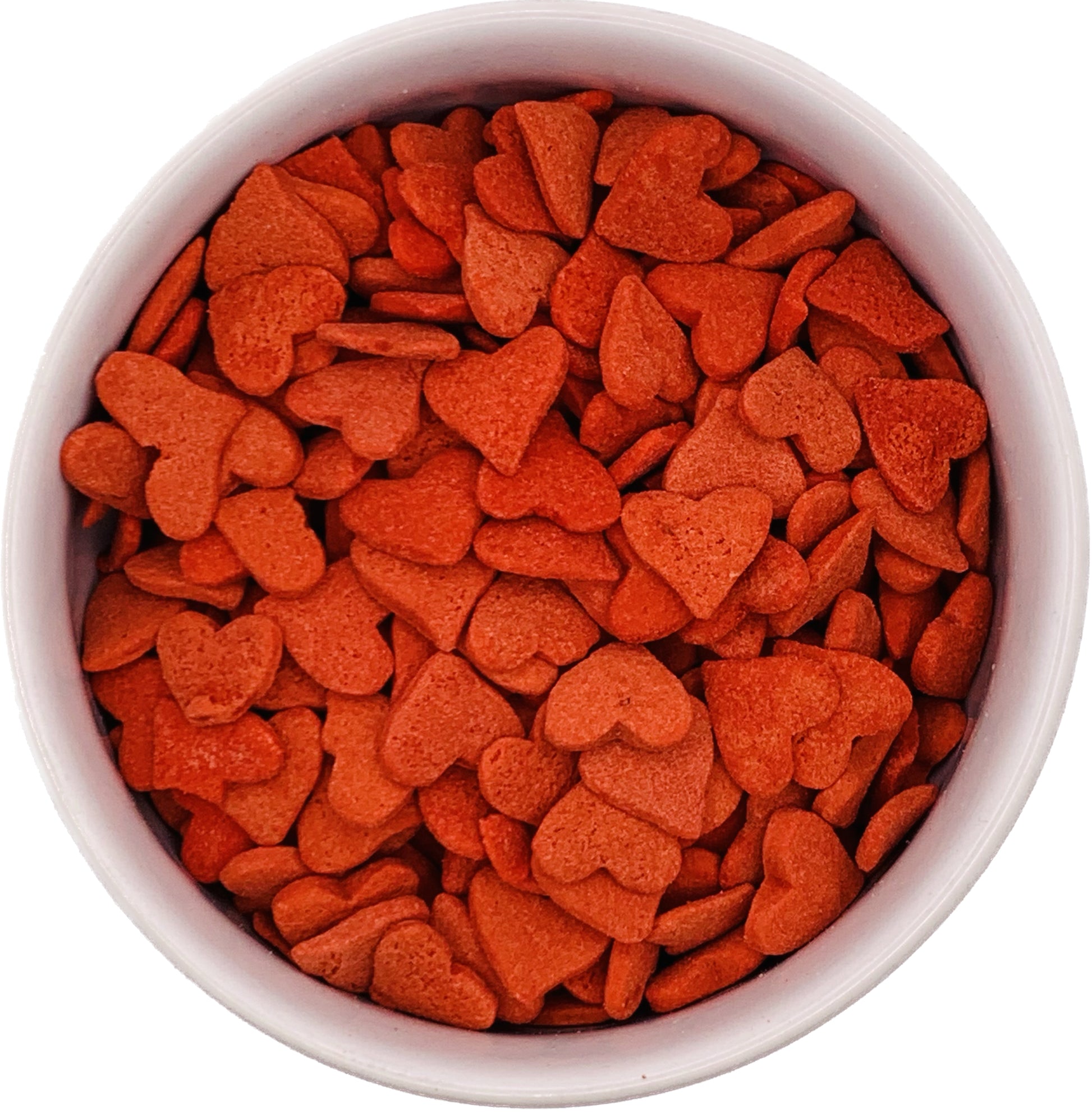 Top-down view of a bowl filled with jumbo red heart sprinkles, each approximately 3/8 inch in size, used for decorating cookies, cupcakes, and cakes.