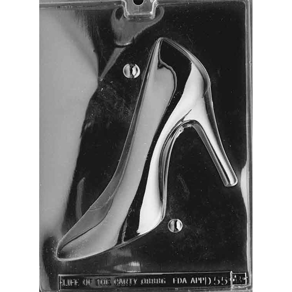 Clear plastic chocolate mold photographed on a dark background showing the other half of a large high heel pump cavity, angled to display the heel, arch curve, and toe shape.
