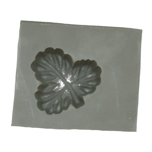 Close-up of a three-leaf rubber mint mold cavity with detailed leaf texture, ideal for candy or craft use