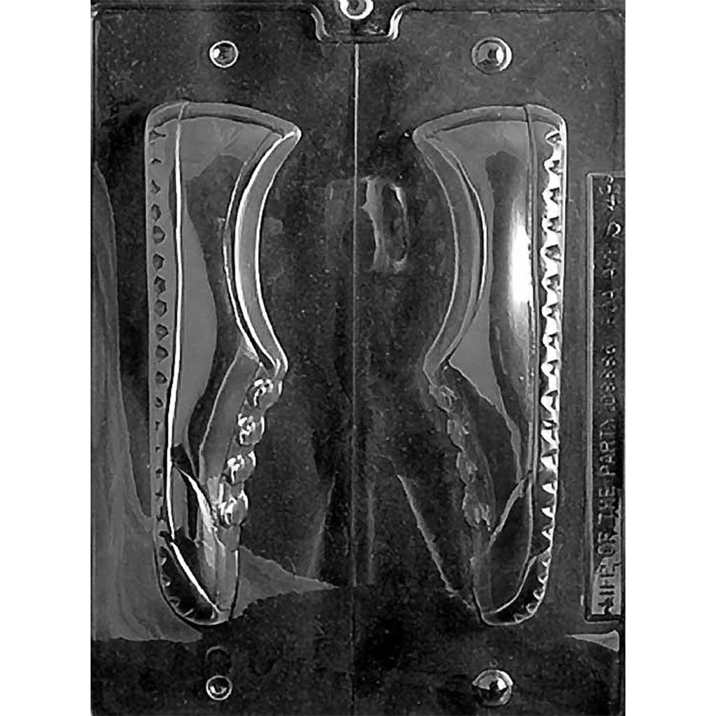Clear two-piece chocolate mold photographed against a black background, featuring matching sneaker halves with raised laces, side panels, and sole details.