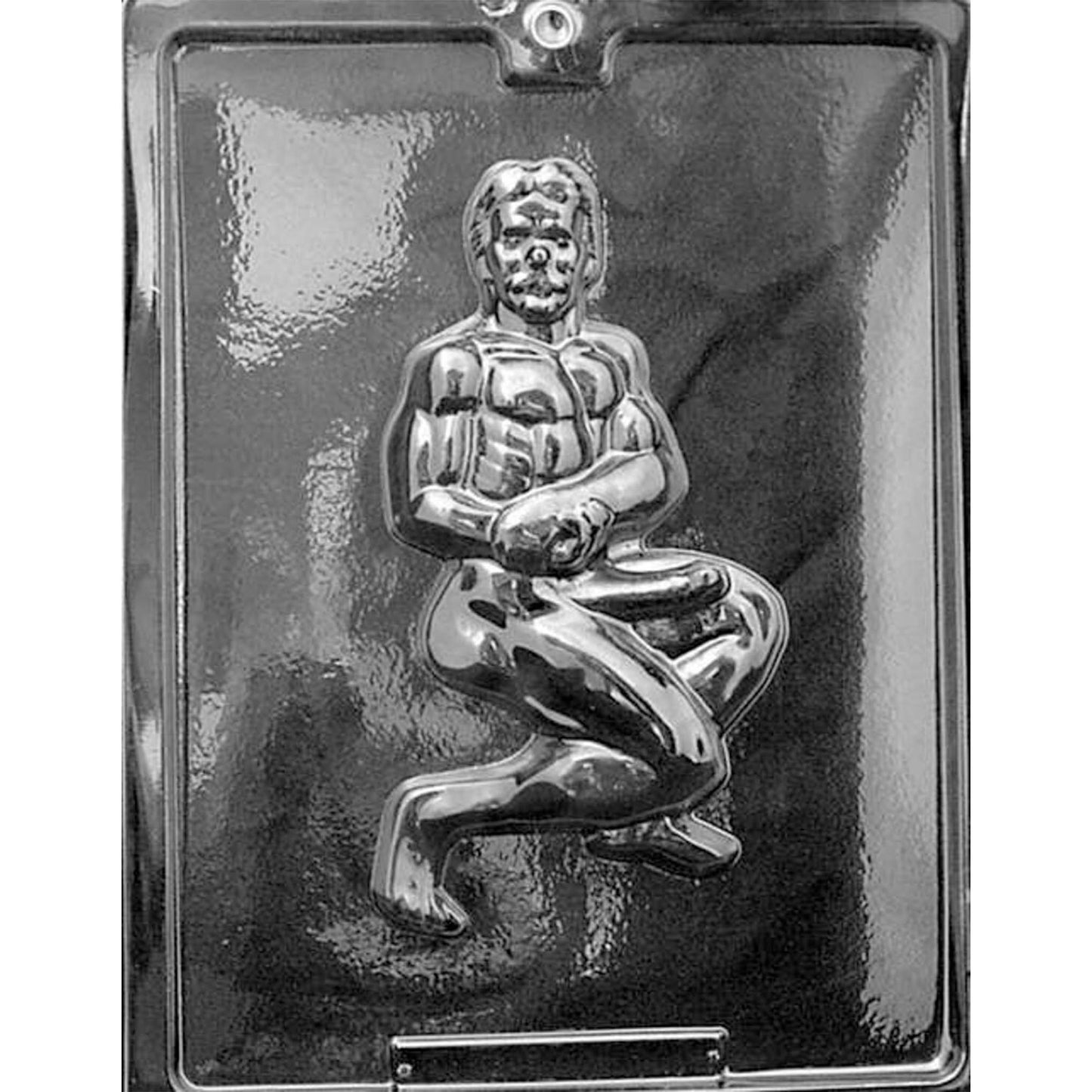 Clear plastic Muscle Man with Erection Chocolate Mold photographed against a dark background, featuring one large cavity depicting a muscular male figure in a kneeling pose with defined facial, torso, clothing, and adult anatomical details.
