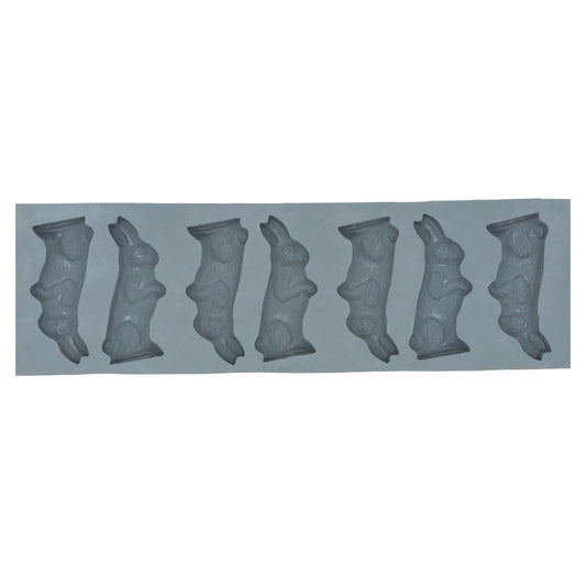 Full sheet of 20 small rabbit-shaped cavities in a natural rubber mold, ideal for Easter treats, baby showers, or seasonal candy making.