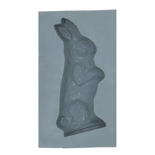 Close-up of a small rabbit-shaped cavity in a natural rubber mint mold, perfect for making cream cheese mints or spring-themed confections.