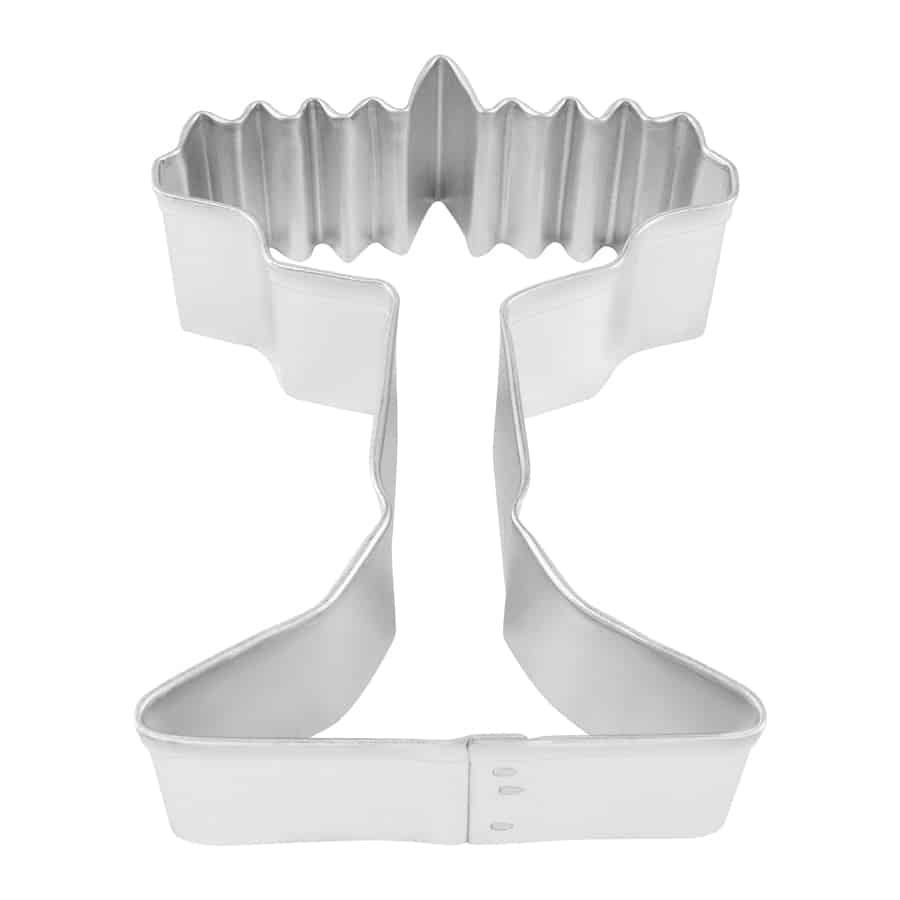 Menorah-shaped cookie cutter with detailed candle holders, photographed from a top-down angle.