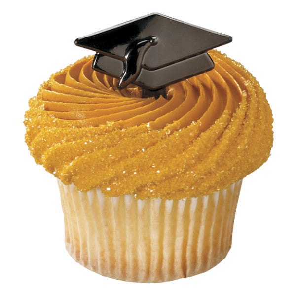 Vanilla cupcake with yellow frosting topped with black graduation cap decoration.