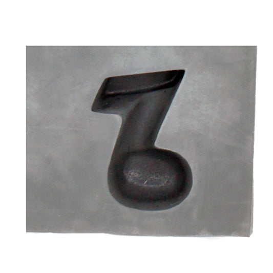 Close-up of a music note-shaped cavity in a natural rubber mint mold, ideal for cream cheese mints, chocolates, or themed party favors.