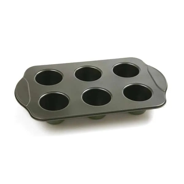 Empty nonstick popover pan with six evenly spaced cavities, perfect for baking tall pastries.