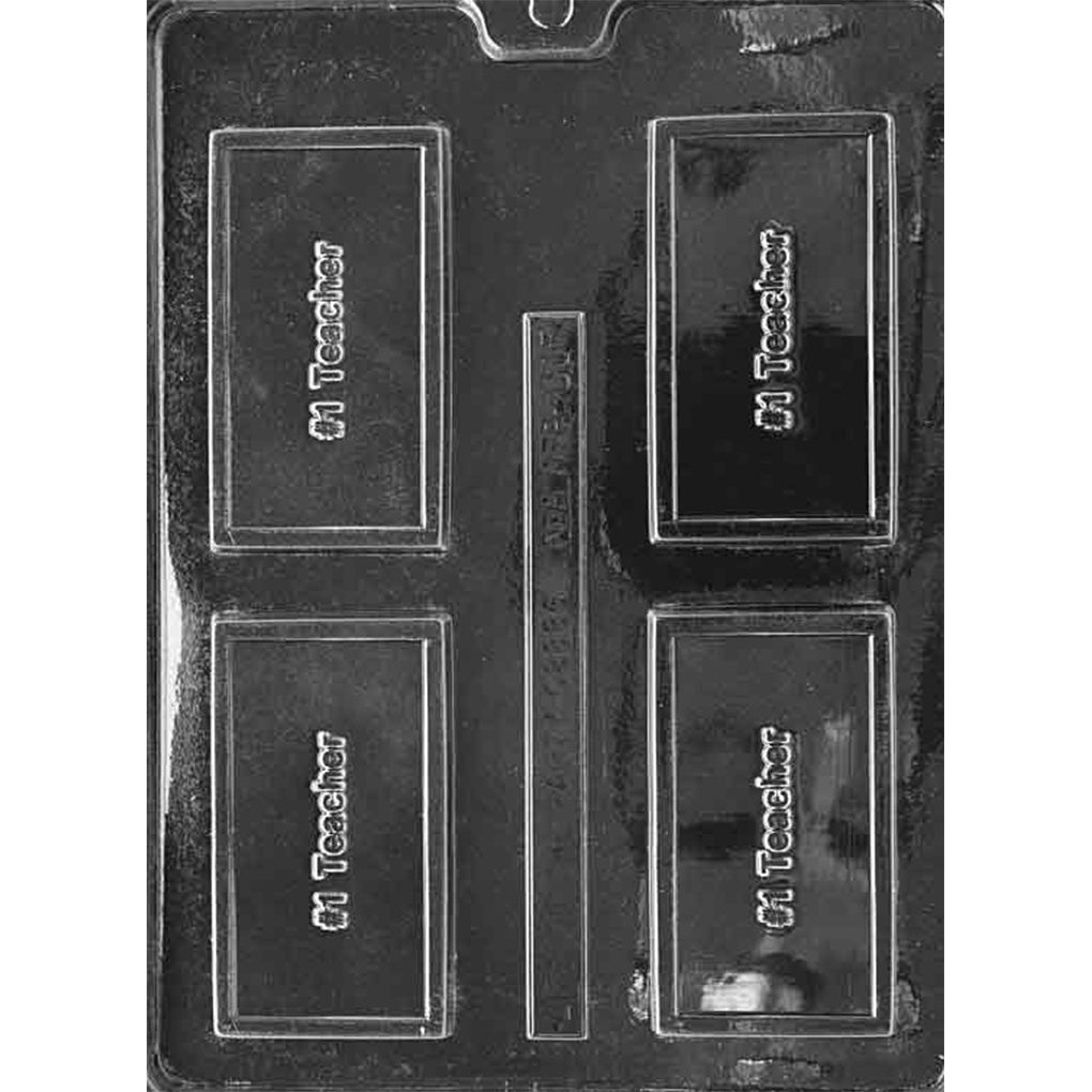 Clear plastic chocolate bar mold with four small rectangular cavities, each with raised “#1 Teacher” lettering, shown on a dark background.