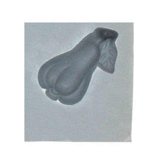 Close-up of pear and leaf rubber mint mold for fruit-themed confections