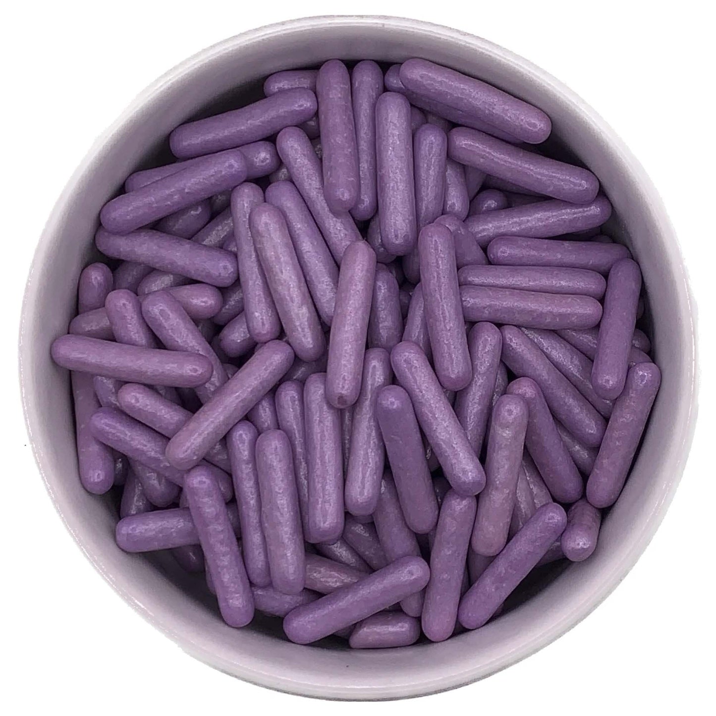 Top-down view of pearlized purple edible rod sprinkles in a bowl, featuring large, cylindrical shapes with a satin-like coating.