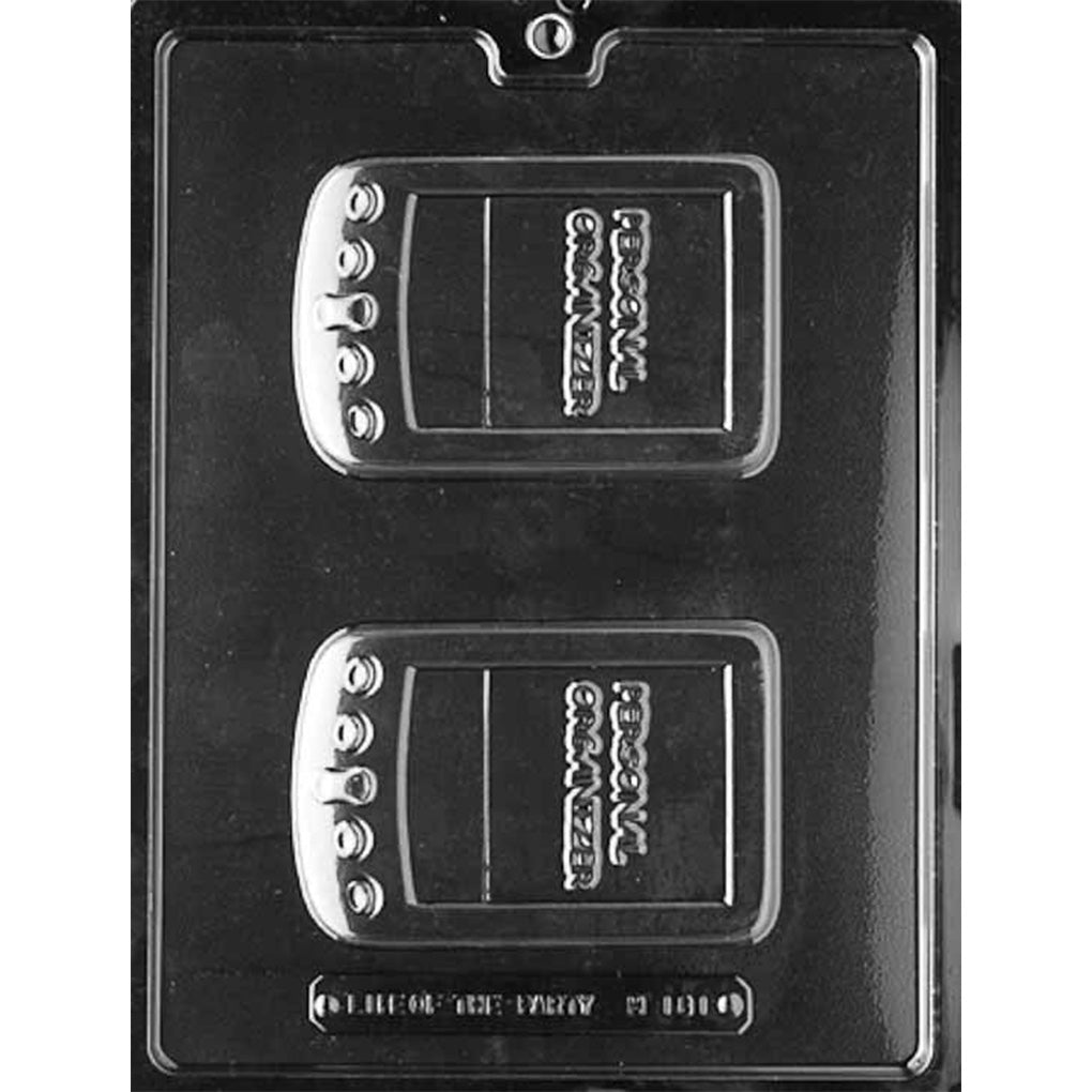 Clear plastic chocolate mold with two personal digital organizer shaped cavities featuring raised button details and a screen area for making retro handheld device chocolates.