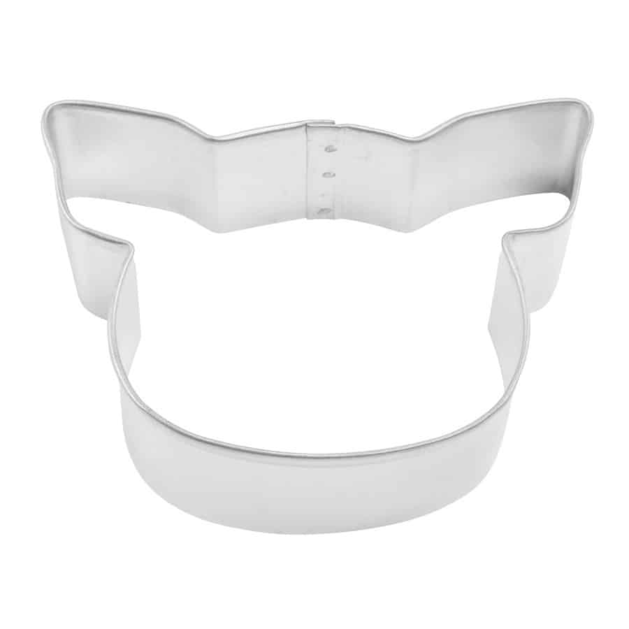 A pig-shaped metal cookie cutter with pointed ears and a rounded snout, lying flat on a white background.