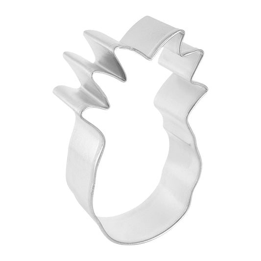 Angled side view of a pineapple cookie cutter, showing its curved metal edges and detailed top ridges, designed for cutting pineapple-themed cookies.