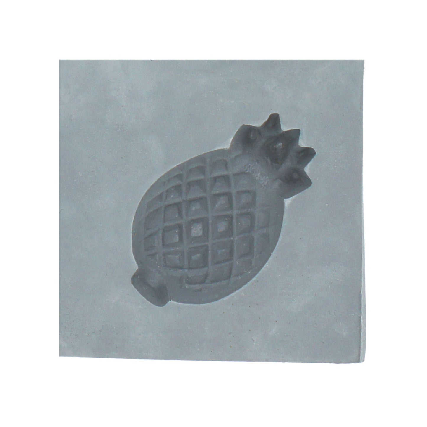 Close-up of pineapple rubber mint mold showing textured diamond detail and leafy top
