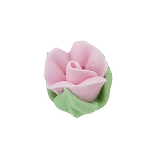 Close-up of a small pink royal icing rosebud with green leaves, about 3/4 inch tall.