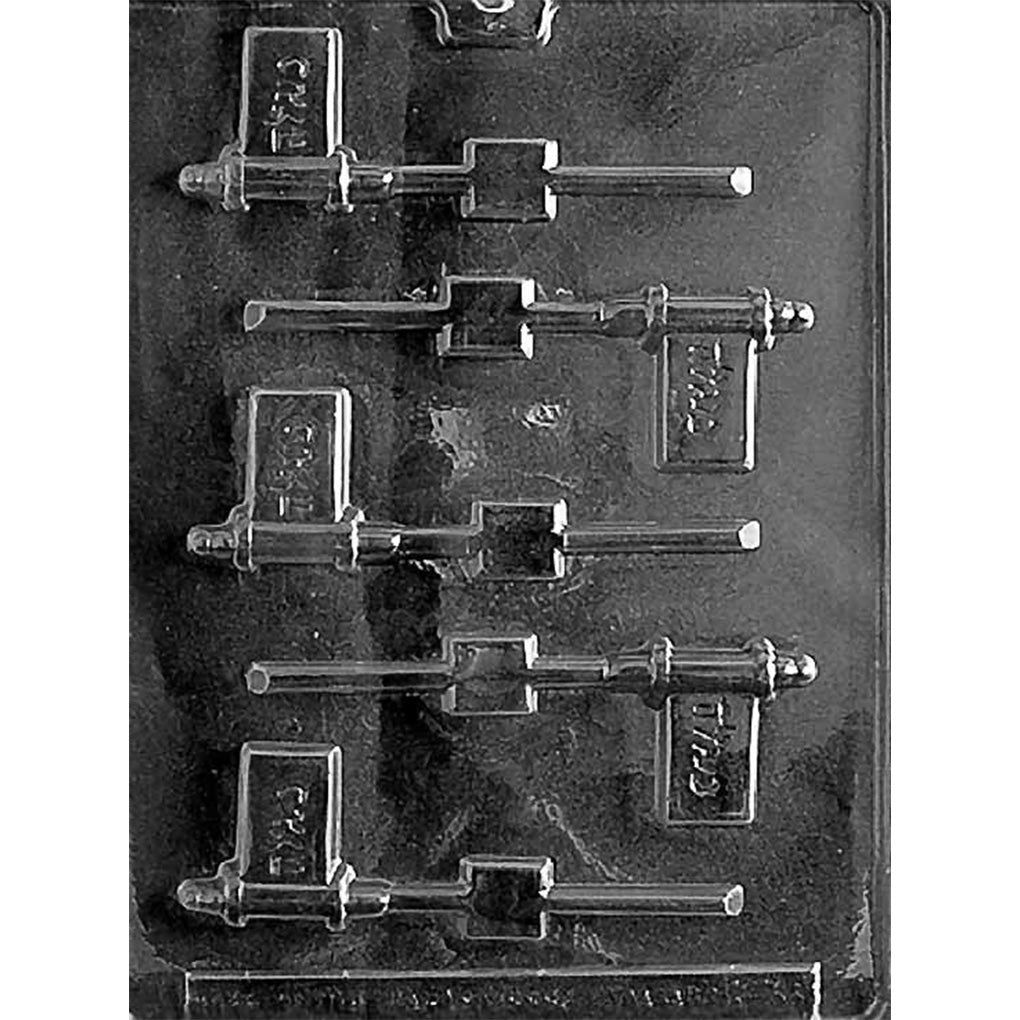 Clear plastic Purim pop chocolate lollipop mold photographed on a black background, showing six small pop-shaped cavities with raised Purim lettering and built-in stick grooves.
