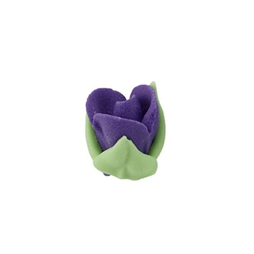 Mini royal icing rosebud in purple with green leaves, small hand-piped flower for cake decorating.