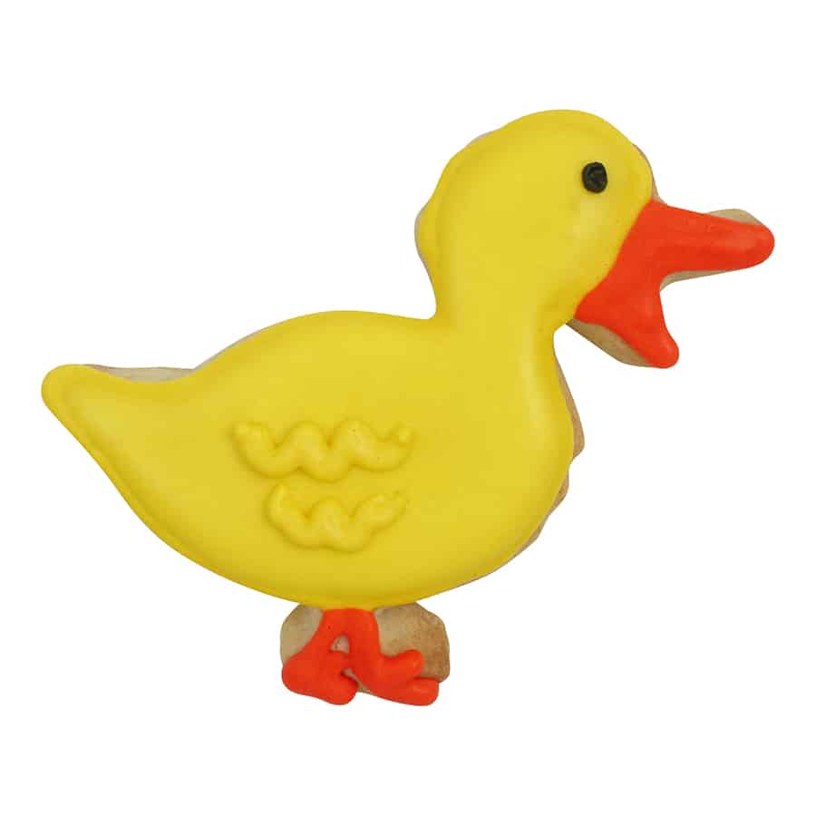 Decorated sugar cookie in the shape of a quacking duck, featuring yellow icing, an orange beak, and webbed feet.