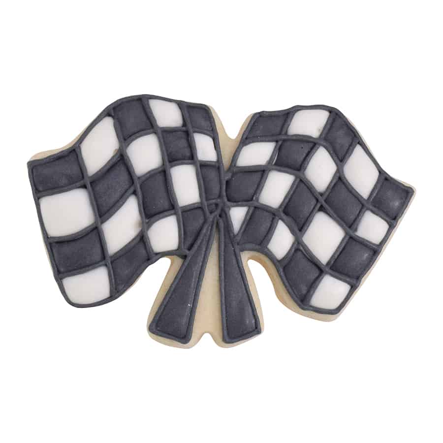 Decorated checkered flag-shaped cookie with black and white icing squares.